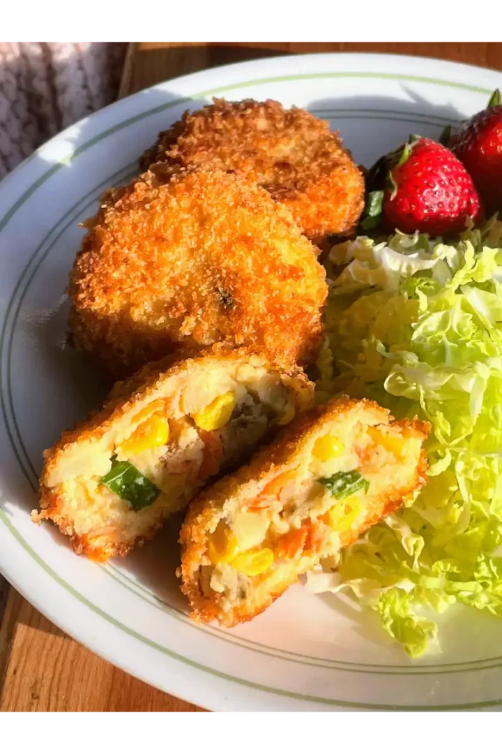 Crispy japanese croquettes with a golden panko crust stuffed with creamy potato and vegetable filling